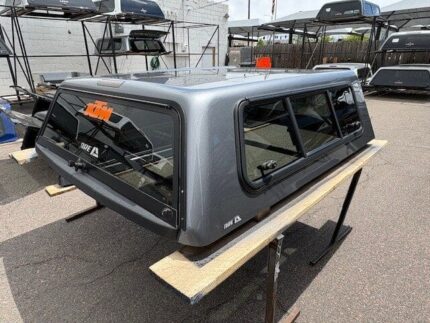 Used GMC Sierra 1500 Fiberglass truck cap that fits a 2019 to Current GMC Sierra 1500 Crew Cab with a 5'8" bed